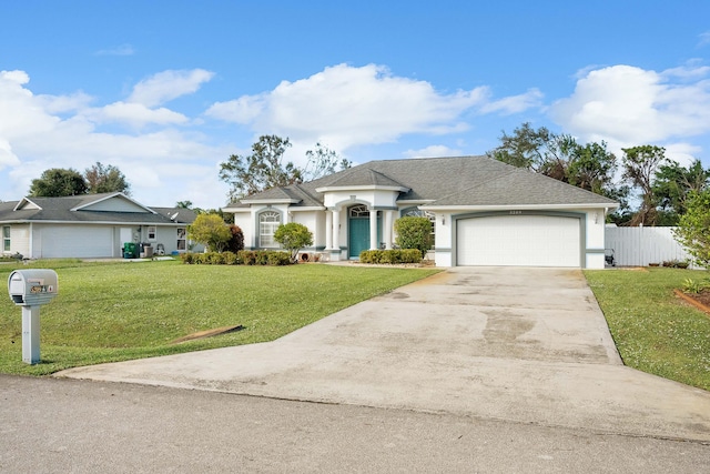 ranch-style home featuring a garage and a front lawn