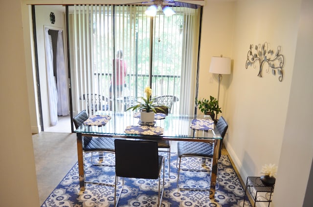 dining space featuring carpet