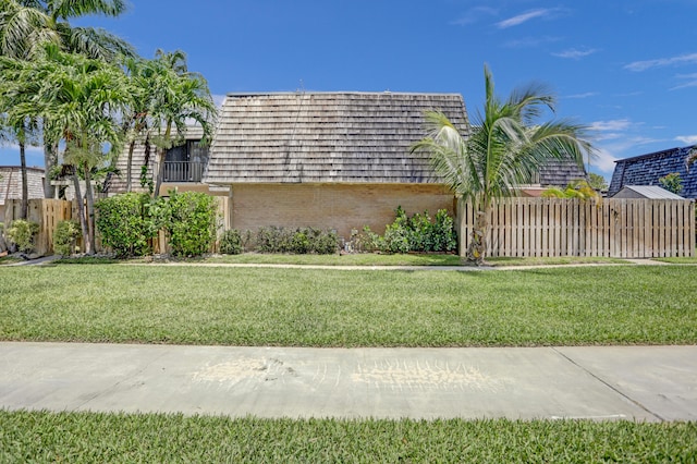 view of home's exterior with a yard