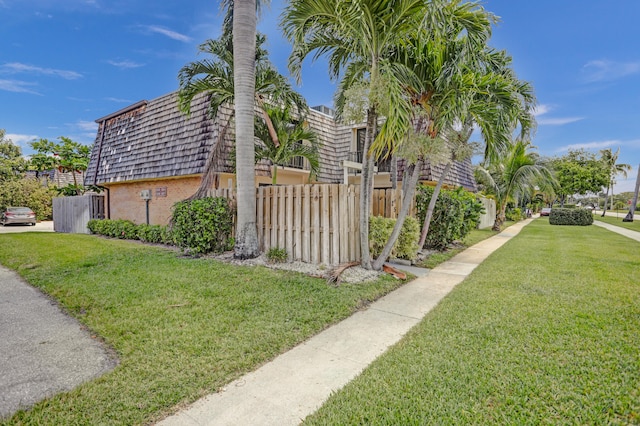 view of property exterior featuring a yard