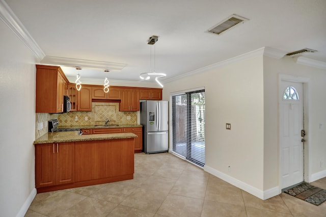 kitchen featuring appliances with stainless steel finishes, sink, light stone counters, pendant lighting, and light tile patterned flooring