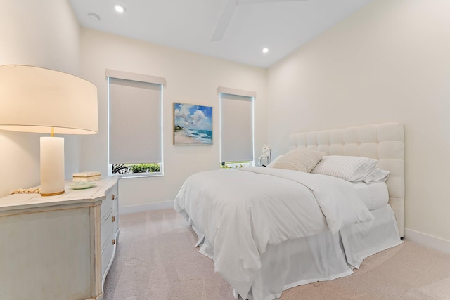 bedroom featuring light colored carpet