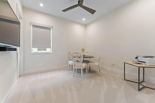 interior space featuring ceiling fan and light colored carpet