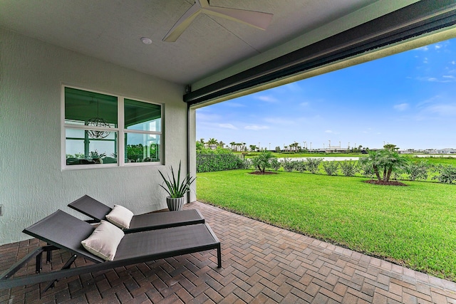 view of patio featuring ceiling fan