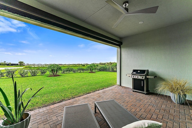 view of patio / terrace featuring area for grilling and a rural view