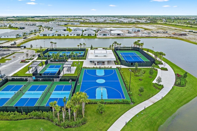 birds eye view of property with a water view