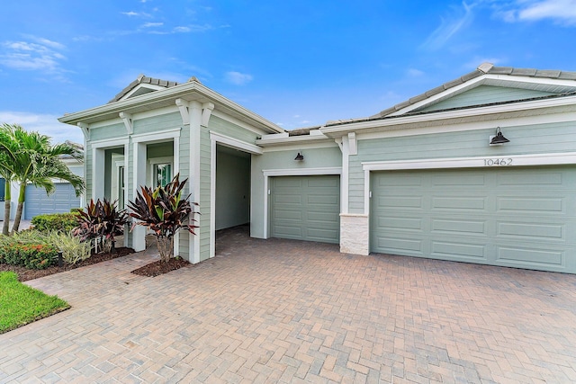 view of front of home with a garage