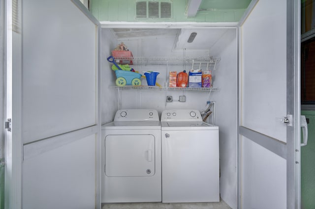 laundry area featuring washing machine and dryer