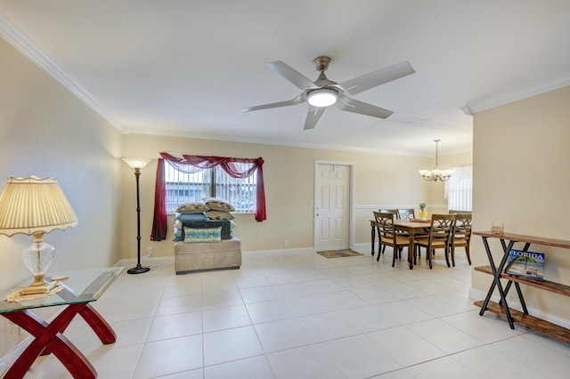 sitting room featuring ceiling fan with notable chandelier, light tile patterned flooring, and ornamental molding