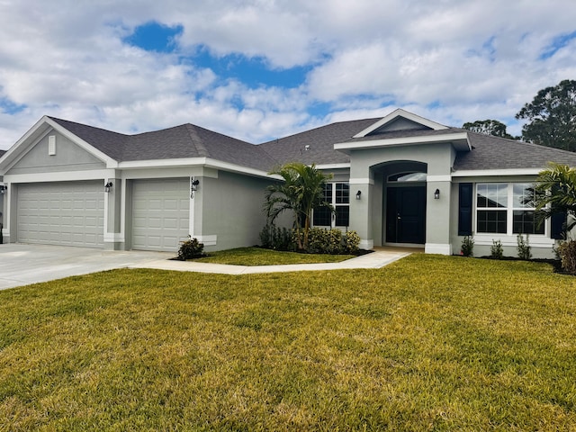 ranch-style house featuring a front yard and a garage