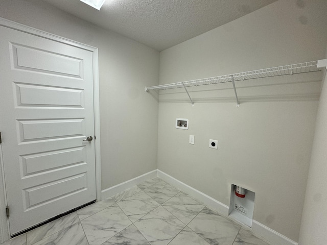 washroom featuring washer hookup, a textured ceiling, and electric dryer hookup