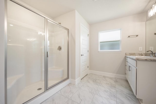 bathroom featuring vanity and an enclosed shower