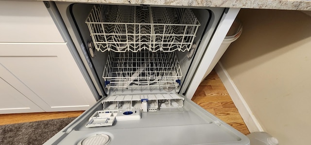 details featuring wood-type flooring and dishwasher