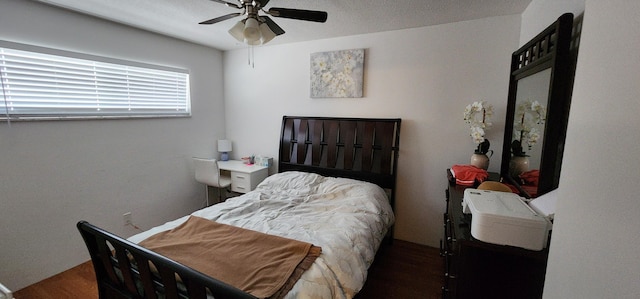 bedroom with ceiling fan and hardwood / wood-style flooring