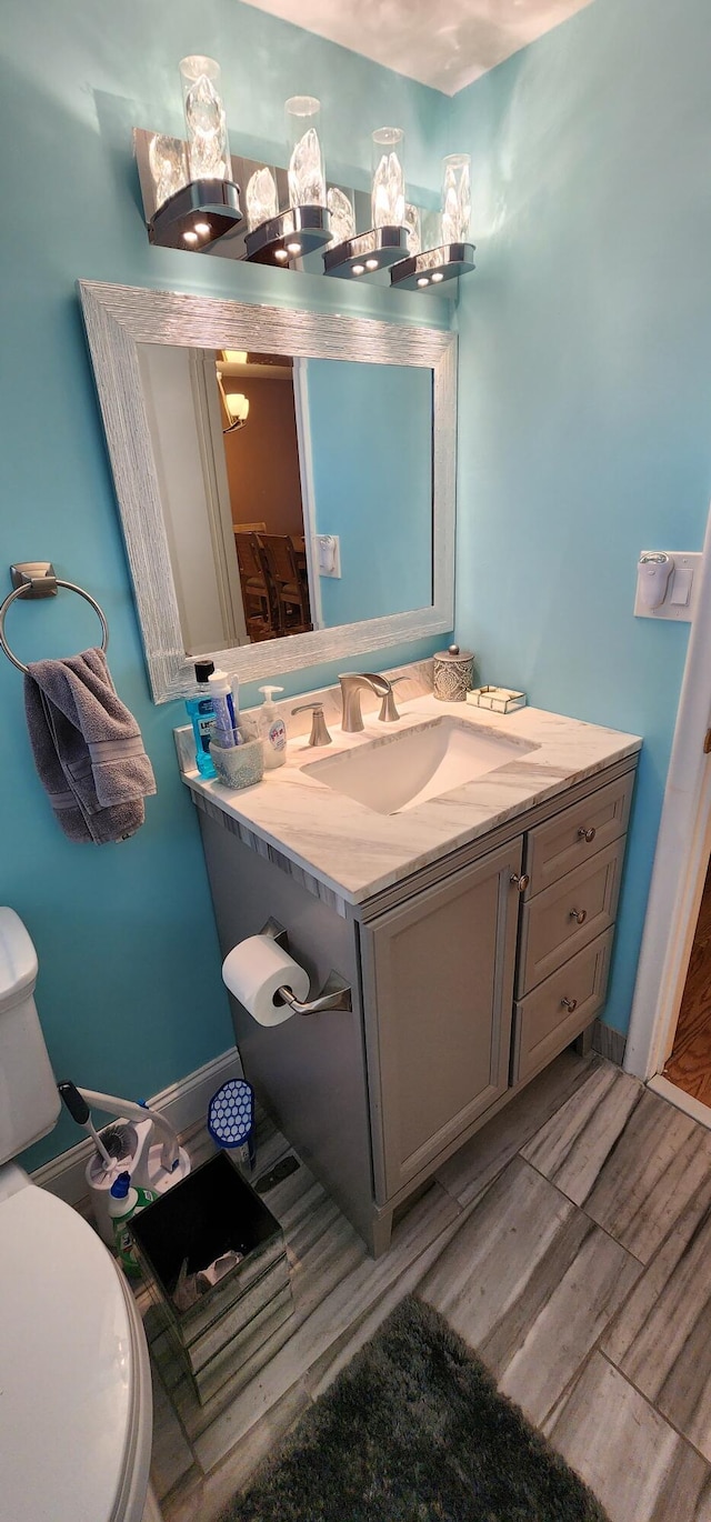 bathroom with toilet and vanity