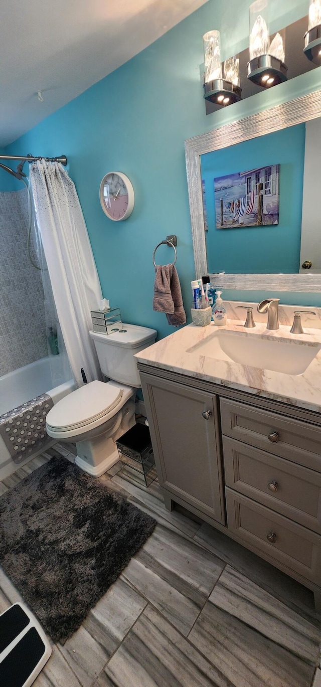 full bathroom with shower / bath combination with curtain, vanity, and toilet