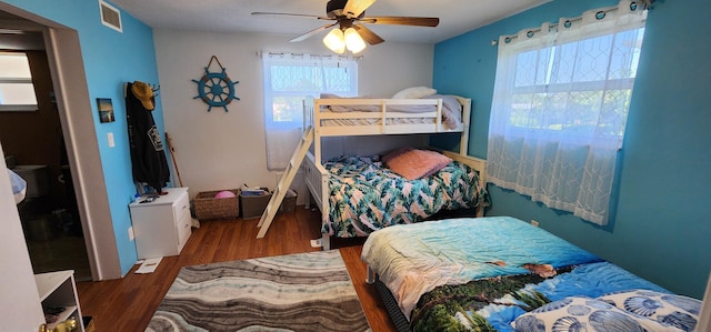 bedroom with ceiling fan and wood-type flooring