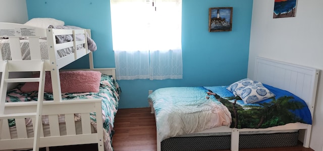 bedroom with hardwood / wood-style flooring