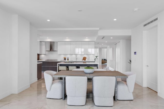 dining area featuring light tile patterned flooring