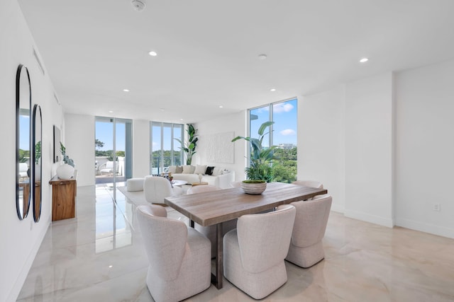 tiled dining room with a wall of windows and a healthy amount of sunlight