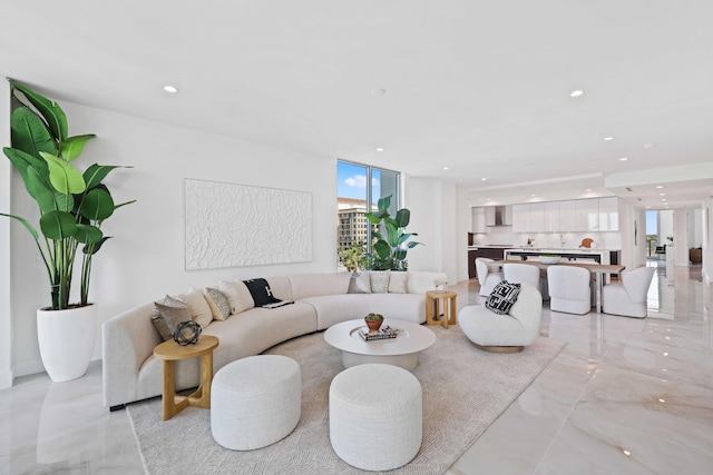 tiled living room featuring expansive windows