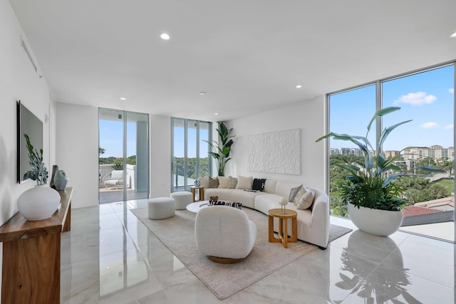 tiled living room with a wall of windows