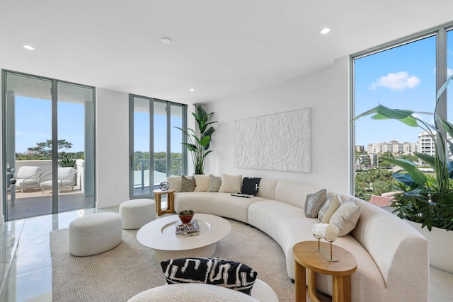 living room featuring tile patterned flooring and floor to ceiling windows