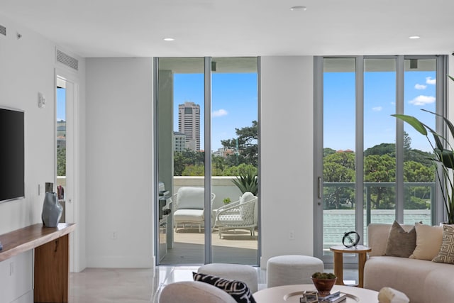 living room with floor to ceiling windows