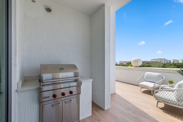 view of patio / terrace with a balcony and grilling area