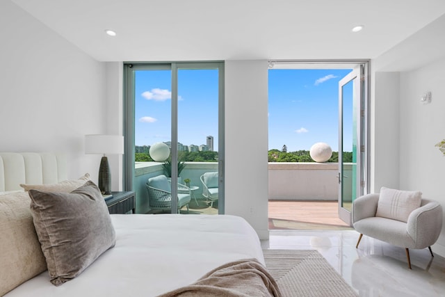 tiled bedroom with multiple windows and a wall of windows