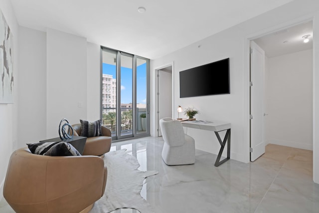 tiled living room featuring a wall of windows