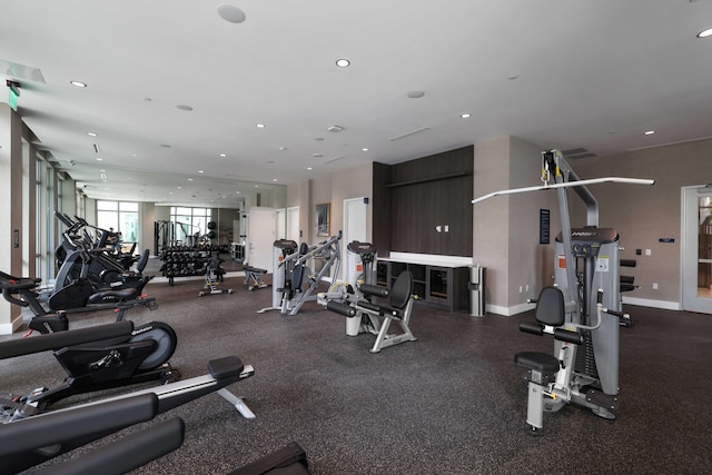 exercise room featuring recessed lighting and baseboards