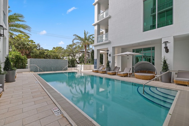 community pool featuring a patio area