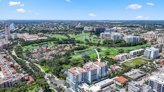 aerial view with a view of city, golf course view, and a water view