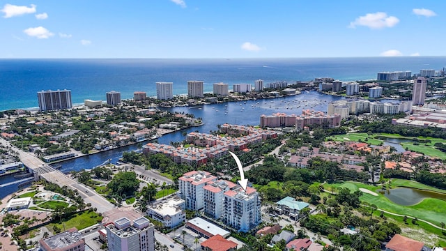 aerial view with view of golf course, a water view, and a city view