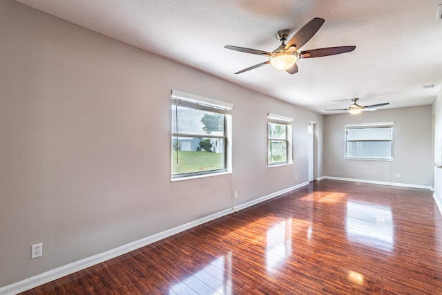 unfurnished room with ceiling fan, a textured ceiling, and hardwood / wood-style flooring