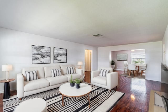 living room featuring dark hardwood / wood-style floors