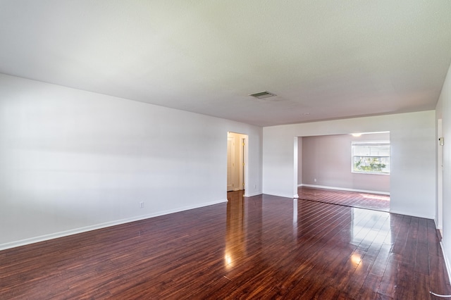 spare room with wood-type flooring