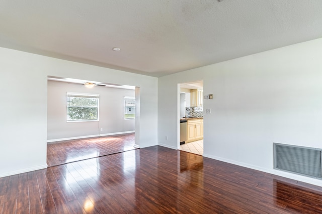 interior space featuring a textured ceiling, ceiling fan, and tile patterned floors