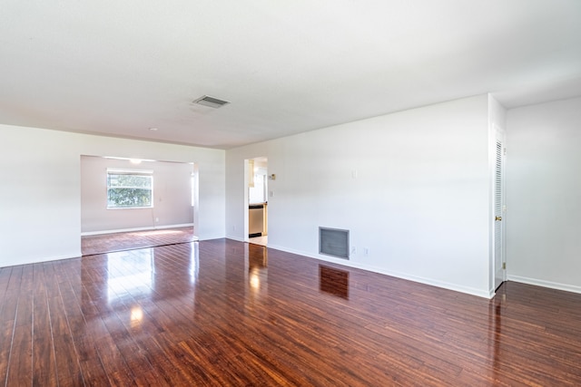 unfurnished living room featuring hardwood / wood-style floors