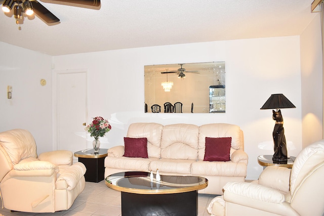 living room with ceiling fan and light tile patterned floors