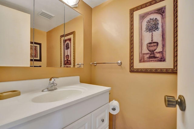 bathroom featuring visible vents and vanity