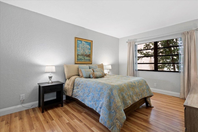 bedroom featuring wood-type flooring