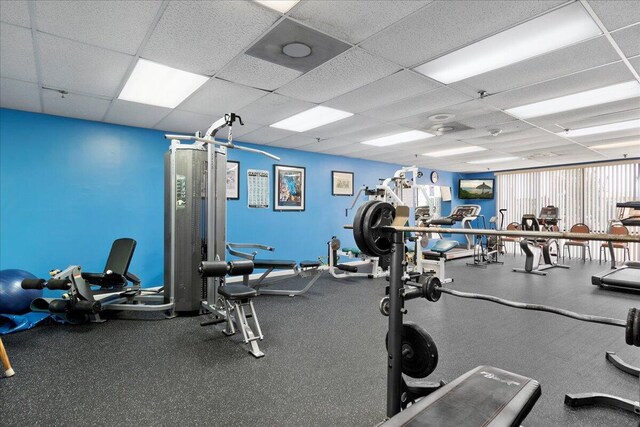 exercise room with a drop ceiling