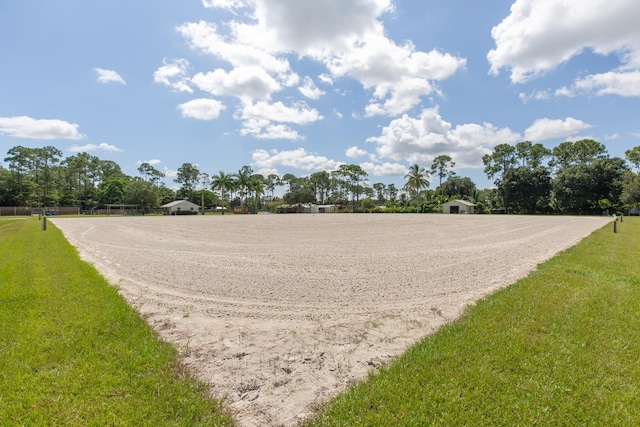 view of property's community featuring a yard