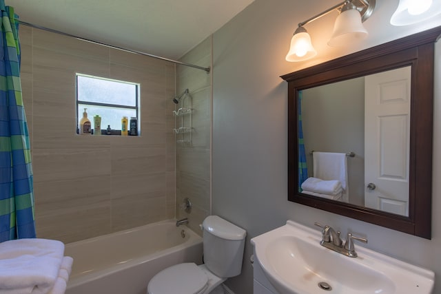 full bathroom featuring sink, shower / bath combo with shower curtain, and toilet