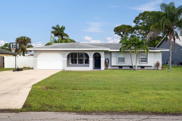 single story home featuring a garage and a front lawn