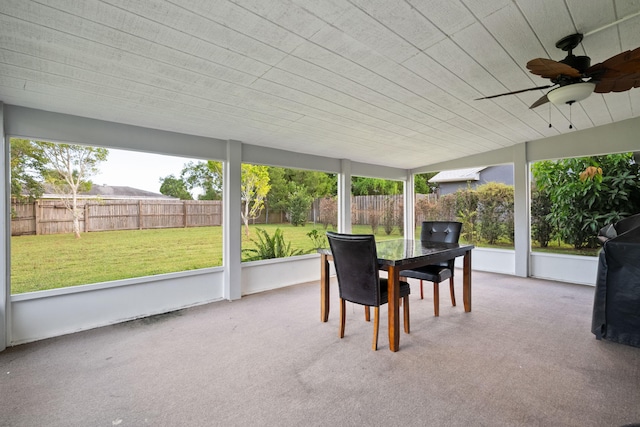 sunroom / solarium with ceiling fan