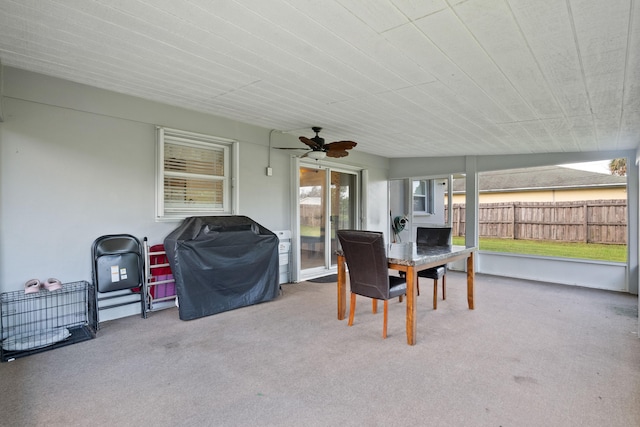 sunroom featuring ceiling fan