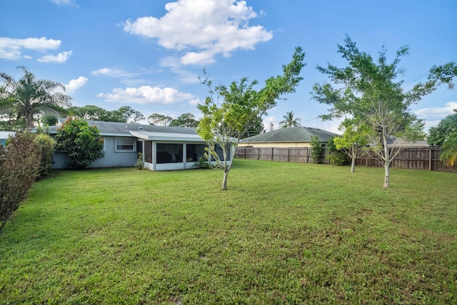 view of yard with a sunroom